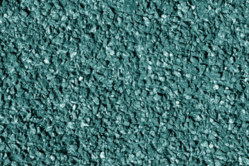 Asphalt texture in cyan tone.