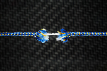 Frayed rope - tension, stress and risk concept