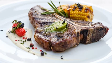Fotobehang T bone steak. Roasted mexican style meat. Juicy tender pork chop. Simple tasty meal © Photodrive