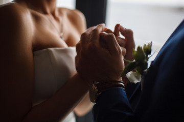 wedding ceremony
Newlyweds are held hands 
young men and women hold each other hands
newlyweds during the marriage ceremony
passionate hugs of a loving couple