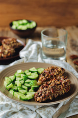 Pecan crust chicken breasts with cucumber's slices