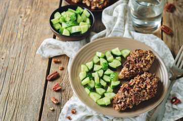 Pecan crust chicken breasts with cucumber's slices