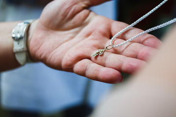 cross in the father's hand