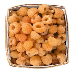 market pint container of golden raspberries isoleted on white