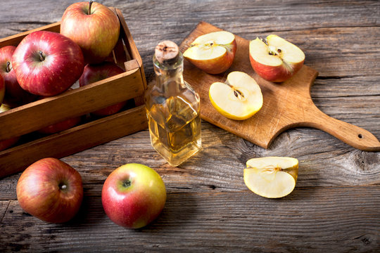 juice of ripe red apples on a wooden table