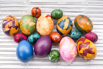 colorful Easter eggs on white wood backgrounds