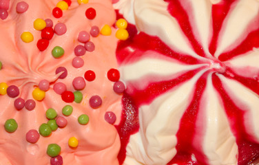 colorful berry ice cream with dragees, close-up. Ice cream, tender cures. Beautiful background of ice cream.
