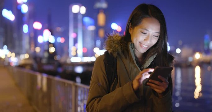 Woman use of mobile phone at outdoor Hong Kong