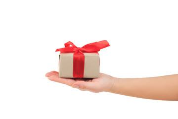 presentation of gift, hand giving a gift wrapped with red ribbon on white background side view