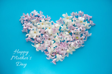 hyacinth flowers on a blue background, greeting card, happy mother's day