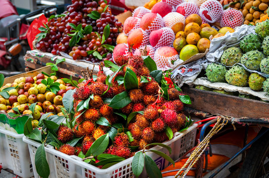 Exotic Asian Fruit On Local Market. Asian Cuisine Concept.Fresh Rambutans,Kiwano Melon,kepundung, Lemon