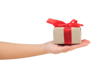 presentation of gift, present on the palm, hand giving a gift wrapped with red ribbon on white background side view