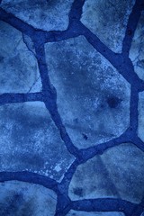 Blue stone wall background. Rock floor, texture