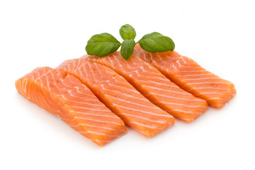 Fresh salmon fillet with basil on the white background.