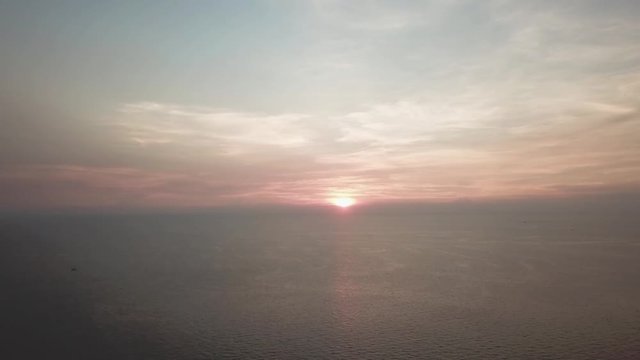 Panorama of beautiful sunset on the ocean. Video. View of sunset seascape in the middle of the ocean. Aerial