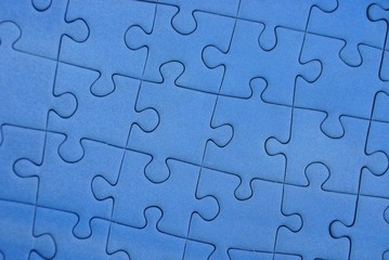 часть мозаики из синих бумажных пазлов