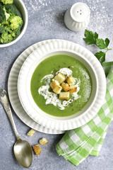Broccoli pureed soup with croutons.Top view.