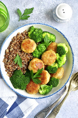 Dinner bowl with buckwheat, chicken meatball and broccoli.Top view.
