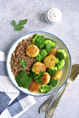 Dinner bowl with buckwheat, chicken meatball and broccoli.Top view.