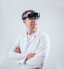 Doctor uses augmented reality goggles.