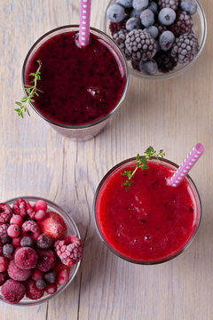 Berry smoothie, garnished with thyme