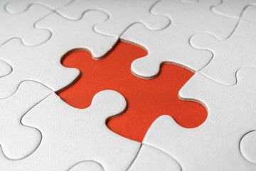 One last piece of white empty puzzle is missing.