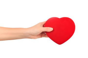 Fototapeta premium female hand holding big bright red heart on white background