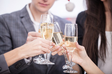 Close up of business team toasting with Champagne