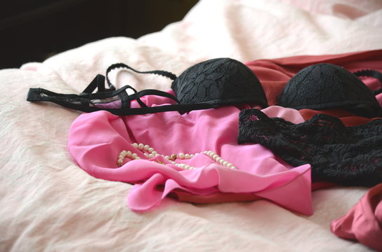Lingerie thrown on bed