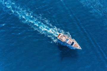 Yacht at the sea in Europe. Aerial view of luxury floating ship at sunset. Colorful landscape with...