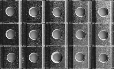 slide screw nuts in a row, abstract industrial background