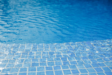 swimming pool with blue water and tile