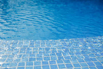 swimming pool with blue water and tile