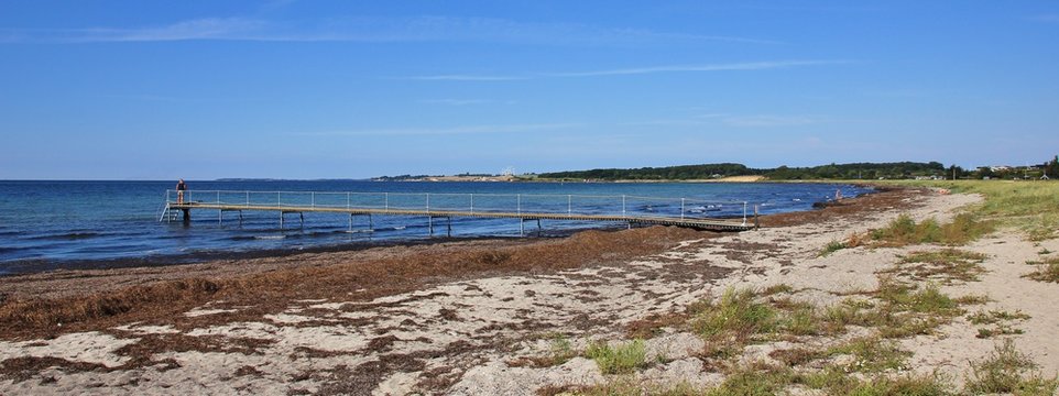 Coast in Naestved, Denmark. Karrebaeksminde. Jetty for swimming.