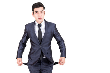 Businessman showing empty pockets isolated on white background