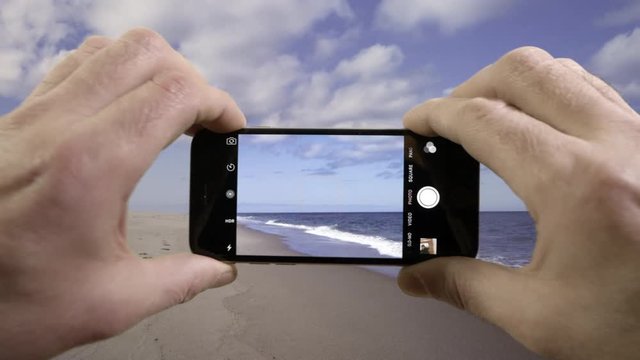 cellphone taking video of Cape Cod beach with waves and sunshine