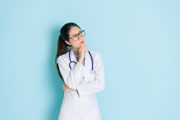 beauty female doctor standing in blue background