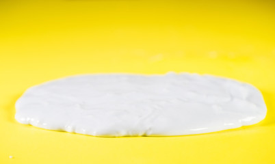 A flat pile of slime on a yellow background