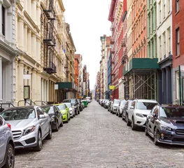 Door stickers New York New York City cobblestone street scene with buildings and cars in the historic SoHo neighborhood of Manhattan