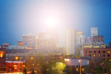 Denver Colorado bright sunlight shining above the downtown skyline