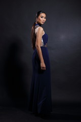 Asian woman in evening long ball dress