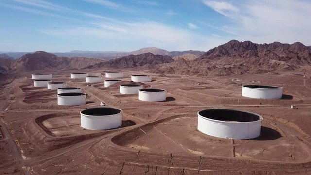Large white tanks for crude oil storage - Aerial footage
