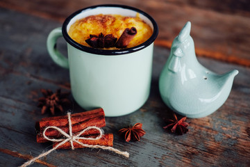 Pumpkin pudding with sweet cream sprinkled with cinnamon powder