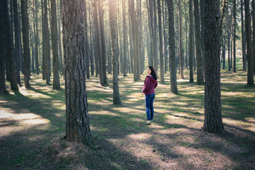 women in to forest.