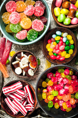 Multicolored candy, jelly and marshmallows in a bowl.