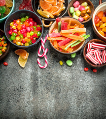 Multicolored candy, jelly and marshmallows in a bowl.