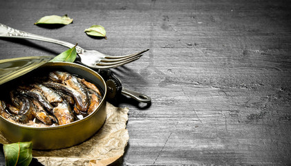 Canned sprats in a tin can.