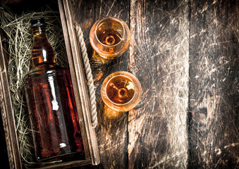 bottle of cognac in an old box.