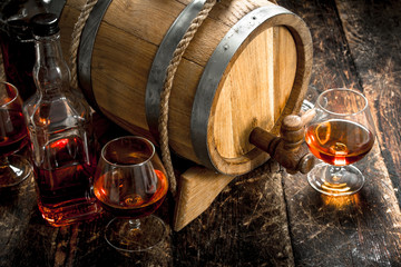 barrel with a long cognac and glasses.