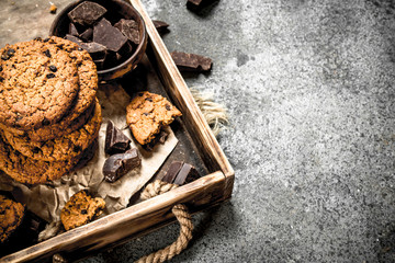 Oatmeal cookies with chocolate in a bowl.